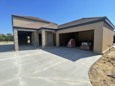 A house with a garage and a garage door.