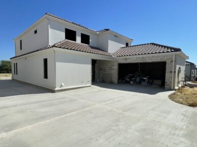 A house with a garage in front of it.