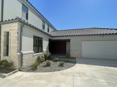 A home with a garage and a driveway.