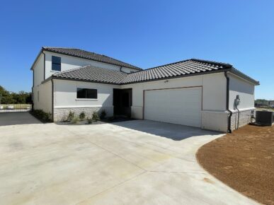 A home with a garage and driveway.