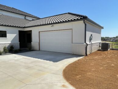 A house with a garage and a driveway.