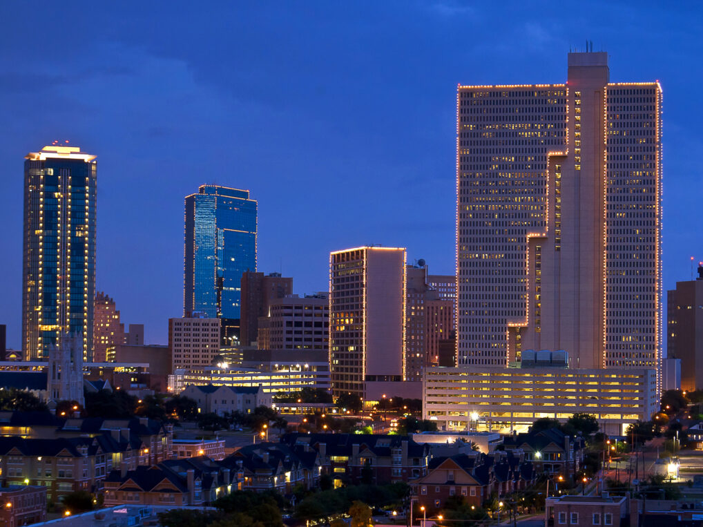 A city skyline at dusk.