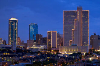 A city skyline at dusk.