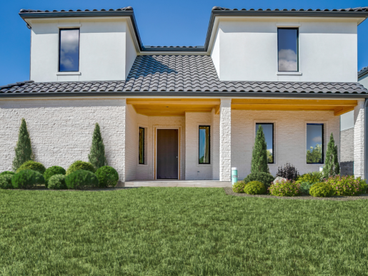 A 3d rendering of a house with a lawn in front.