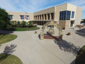 An aerial view of a building with an archway.